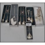A collection of boxed German silver plated dessert cutlery to include cake server, dessert spoons