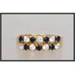 An 18ct gold ring  with pave set sapphire and white stones. Marked 750 tests 18ct gold  . Weight 2.