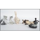 A collection of cat figurines to include Royal Doulton white Persian cat together with a Beswick