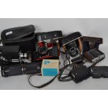 A collection of cameras to include Praktica Tuova B with lens in leather case, Voightlander Vito