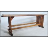 A near pair of 19th century French rustic pine refectory pig benches. Each with shaped single