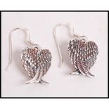 A pair of 20th century decorative silver ladies ea