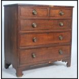 A 19th century Georgian mahogany chest of drawers having cross branded borders raised on bracket