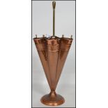 A vintage 20th century copper and brass umbrella s