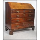 A Georgian Mahogany bureau, circa 1800, the banded fall front opening to reveal a fully fitted