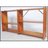 A retro 20th century modular pine open wall unit, having adjustable shelves together with another