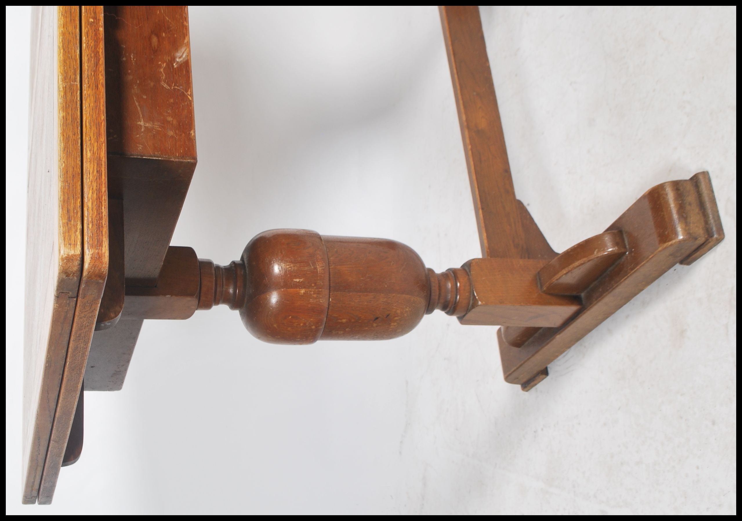 A 1930's oak draw leaf refectory dining table raised on turned legs united by stretcher having - Image 3 of 4
