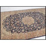 A 20th century decorative finely woven Persian / Islamic floor carpet rug having geometric