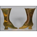 A pair of Victorian brass and copper mounted easel spill vases, each in the form of a lady`s boot,