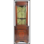 A good mahogany Georgian revival astragal glazed display corner cabinet having lined shelves over