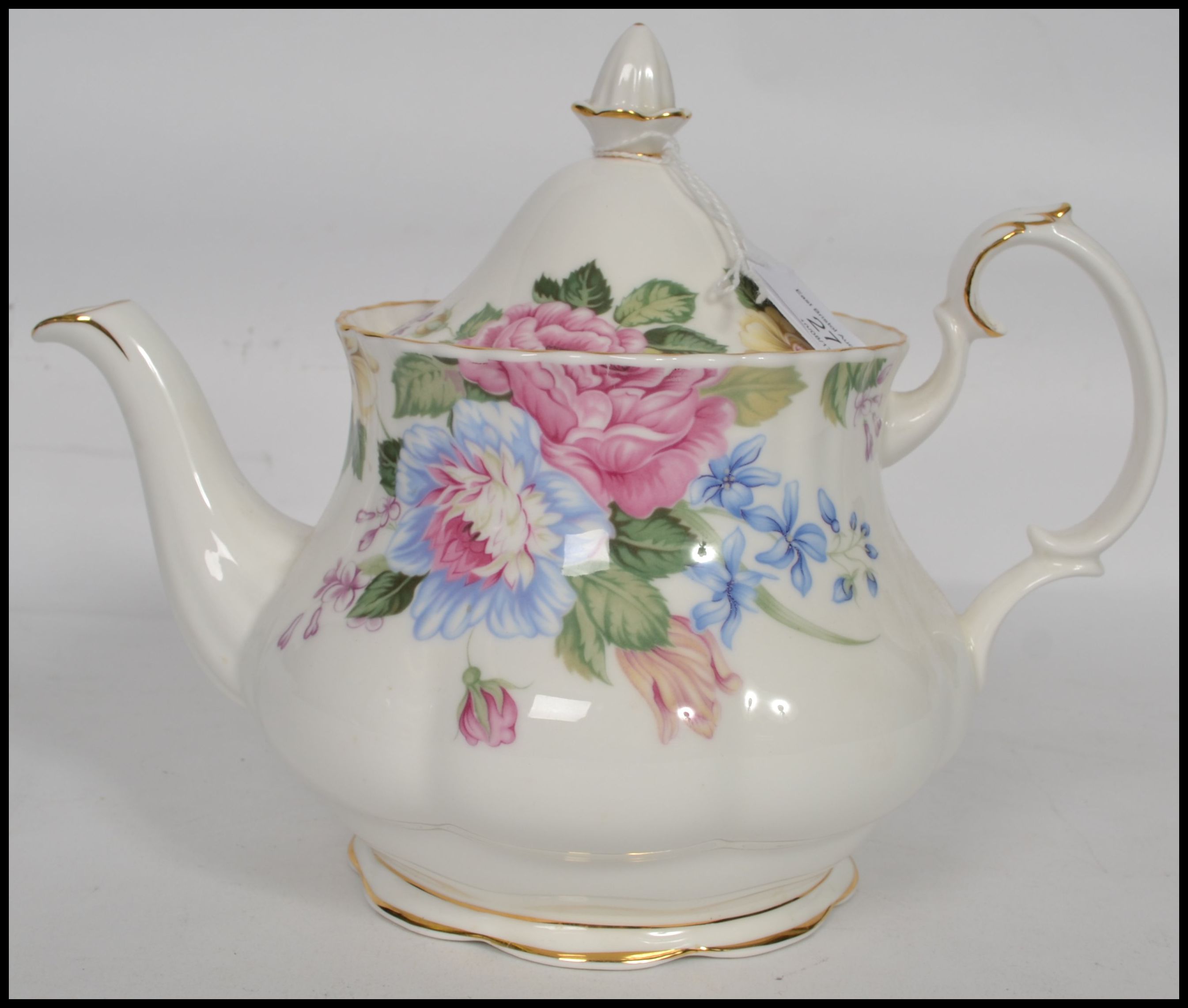 A Royal Albert ' Beatrice ' pattern teapot in a ch
