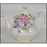 A Royal Albert ' Beatrice ' pattern teapot in a ch