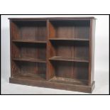 An Edwardian mahogany double open window library lawyers bookcase cabinet having a plinth base