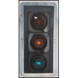 A large set of Industrial traffic lights complete with the blinker hoods and raised on tall