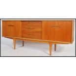 A retro 20th century teak wood long sideboard having a central bank of three drawers flanked by a