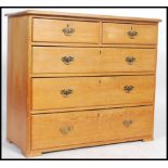 A Victorian country pine 2 over 3 chest of drawers having a flared top with brass drop handles to