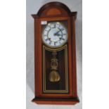 A James C Huntington wall clock having a 31 day movement with enamel face, faceted hands and roman