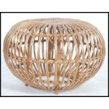 A retro 20th century wicker stool / pouffe entirel