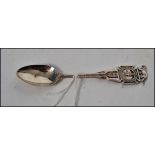 An unusual silver Army Rifle Association teaspoon with decorative and oval bowl. Hallmarks for