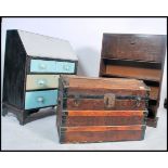 A 19th century wooden and canvas bound dome top steamer trunk together with a 1920's oak student