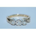 A hallmarked 9ct gold and diamond three stone ring. Hallmarked Sheffield. Size K. Weight 2.6g.