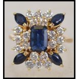 A stunning Art Deco 25 stone Sapphire and Diamond rectangular cluster ring. The central 7.4 x 4.