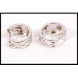 A pair of ladies 14ct white gold earrings of creol