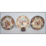 A group of four 19th century Royal Crown Derby ceramics to include an inkwell, Imari plates etc.