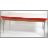 A good 1950's large formica and chrome refectory hair pin leg dining table. The table raised on