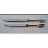 A Danish silver handled fish knive knife and another, both with fabulous shaped handle being