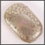 A silver white metal vesta case of oval form with