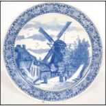 A 20th century Delft ceramic wall hanging charger