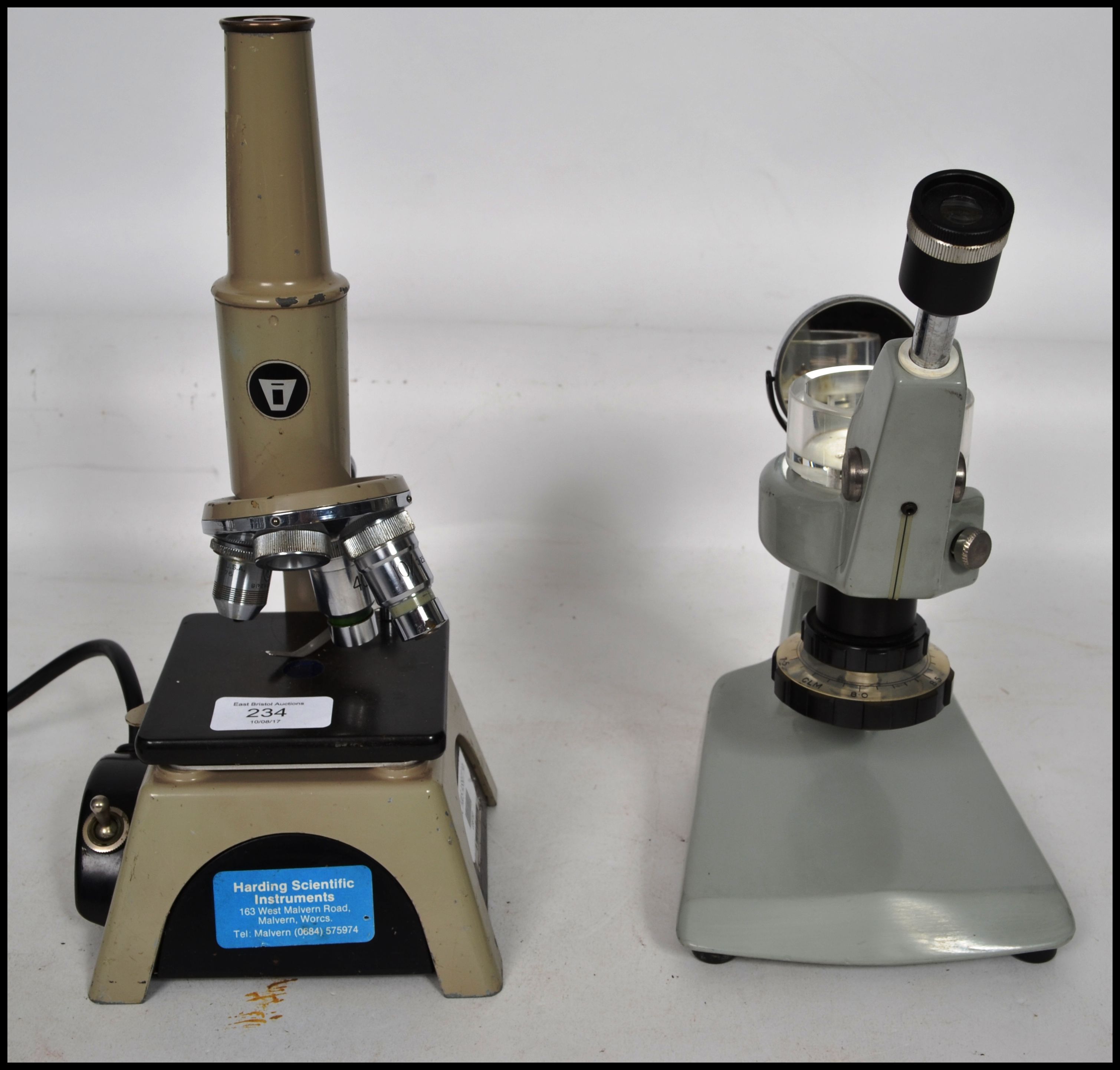 A vintage 20th century microscope with three objec