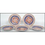 A collection of five circa 1900's Japanese  Imari patterned, each plate having a ribbon edge /