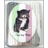 A good silver cigarette case with an enamel plaque of a cat in the suffragette manner bearing