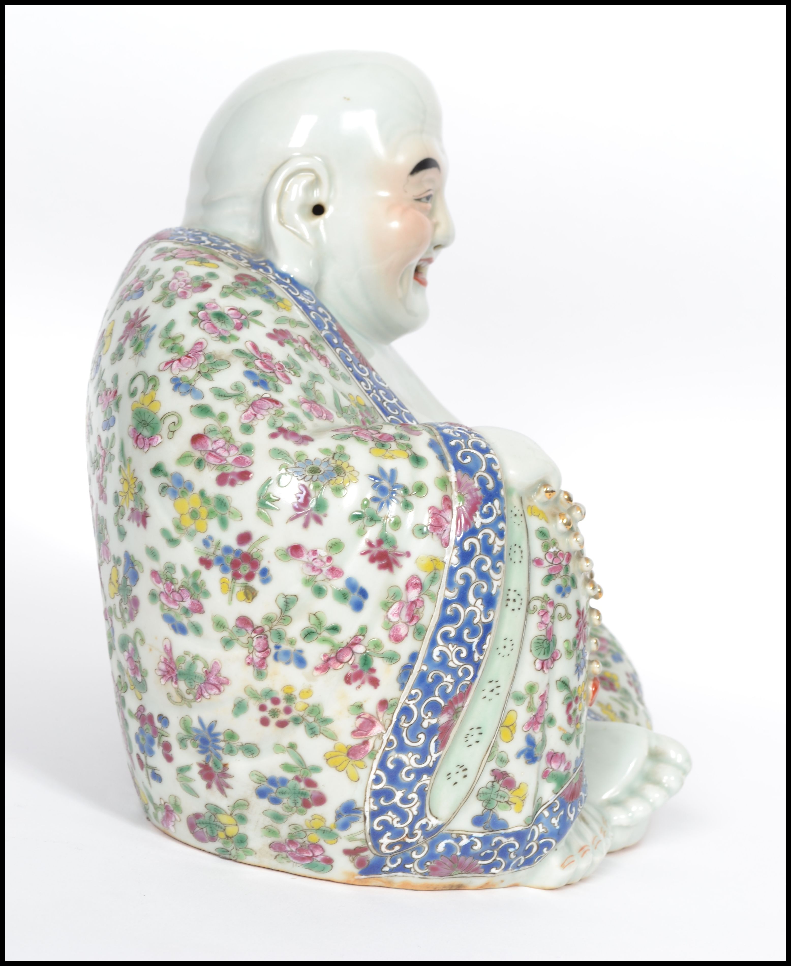 An Oriental ceramic large seated laughing Buddha decorated in famille rose patterned robes holding - Image 2 of 8