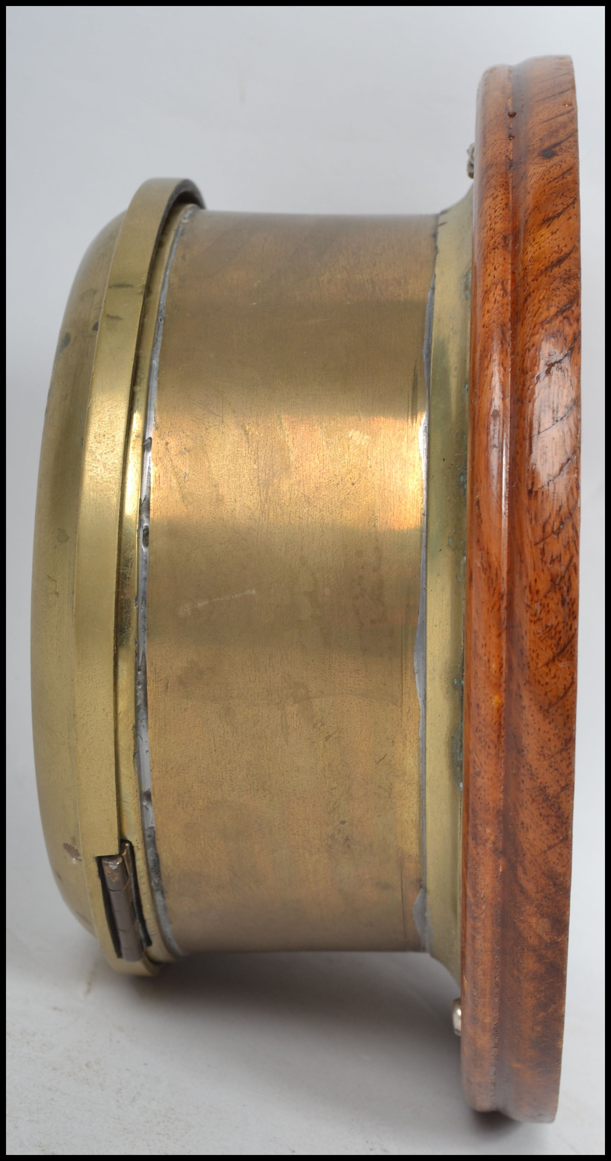 A early 20th century brass bulkhead nautical ships clock having a roman numeral chapter ring, - Image 3 of 5