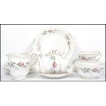 A vintage 20th century Paragon floral tea set in the Bridal Rose pattern consisting of six cups,
