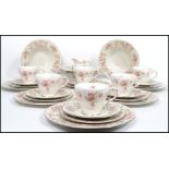 A Royal Doulton tea and dinner service decorated in the Woodland Rose pattern TC1123 consisting of