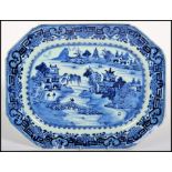An early 19th century Chinese blue and white charger decorated with a stylised border and a