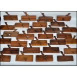 A large collection of vintage 20th century woodworking moulding planes to include a left and right