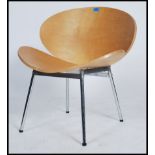 A 20th Century bent plywood easy lounge chair raised on tubular chrome legs in the manner of