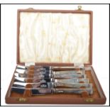 A set of 6 20th century cased silver hallmarked handled knives complete in the presentation case