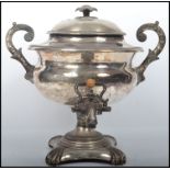 A large 20th century silver pated samovar of bulbous form complete with the lid, tap and having twin