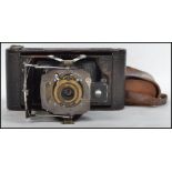 A vintage early 20th century Kodak 1A folding bellows camera complete in original Kodak case.