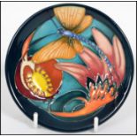 A Moorcroft ceramic tube lined coaster pin dish decorated in the Mayfly pattern complete in the