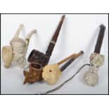 A collection of vintage pipes to include Meerschaum Pipes, novelty, one modelled as a Arabs head