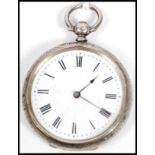 A silver hallmarked chase decorated open faced pocket watch, Roman numeral chapter ring on enamel