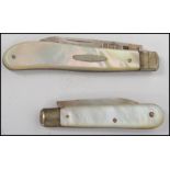 Two silver hallmarked mother of pearl handled fruit pen knives one being hallmarked for Birmingham