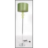 A 20th century / contemporary retro style chrome standard lamp with cylindrical green shade with